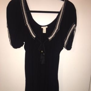Black and white flowy, loose fitting dress.
